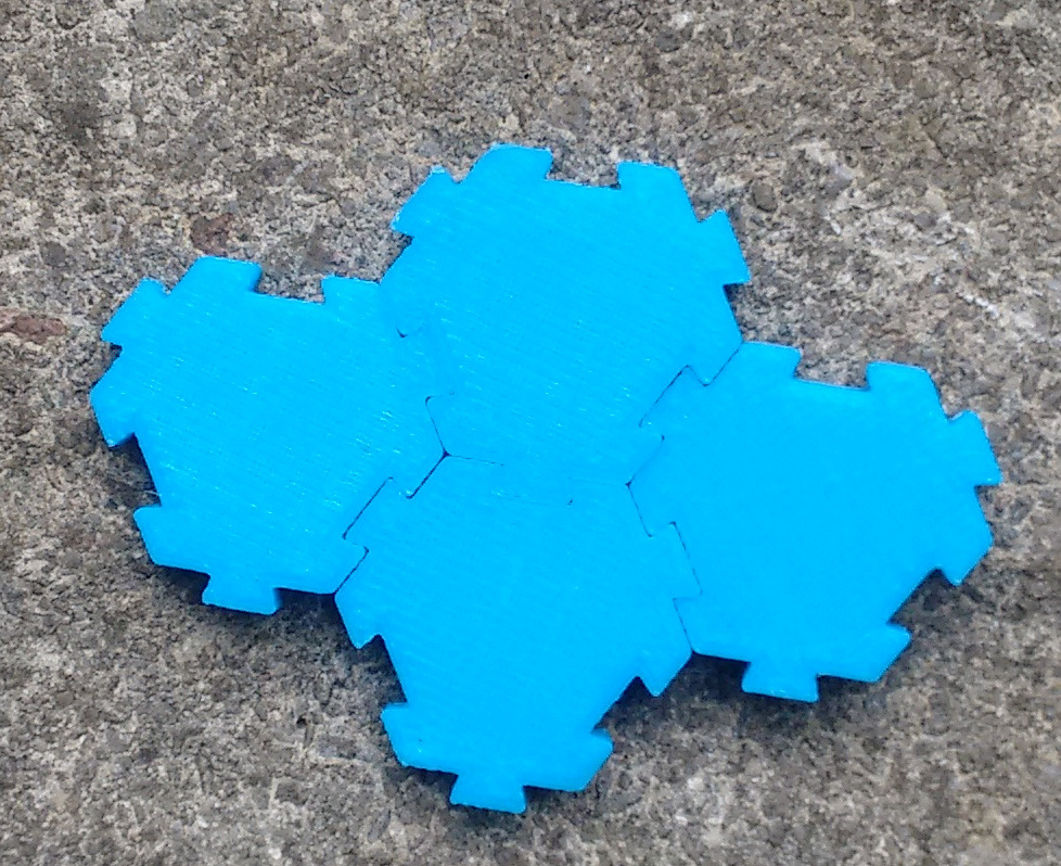Interlocking hexagonal tiles